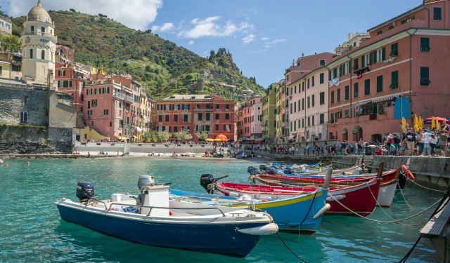 Boats in front of a coastal Italian town